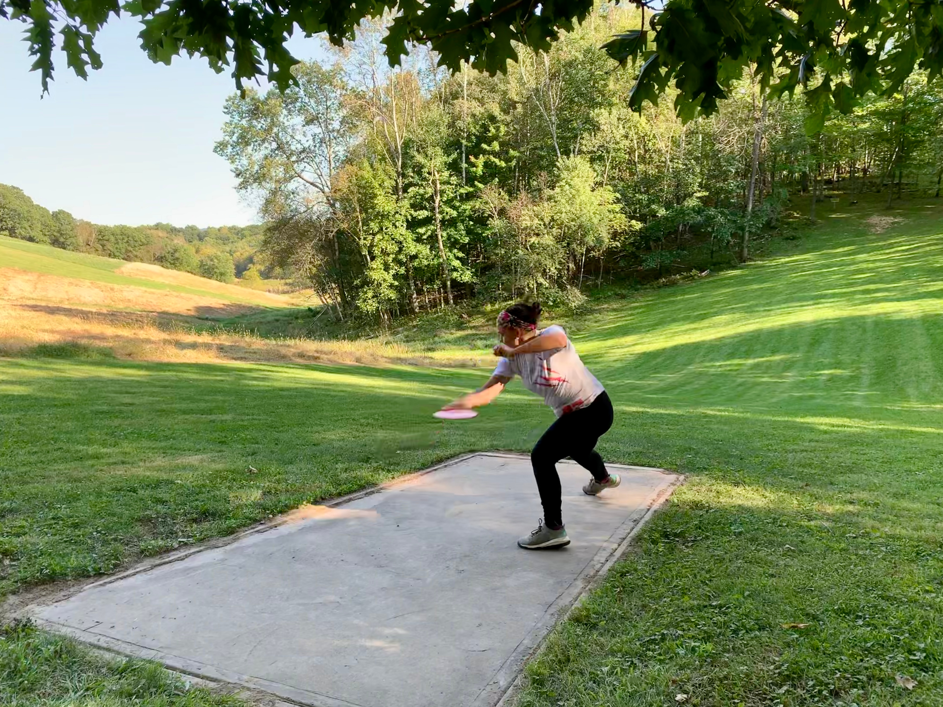 A woman preparing to throw a disc golf disc