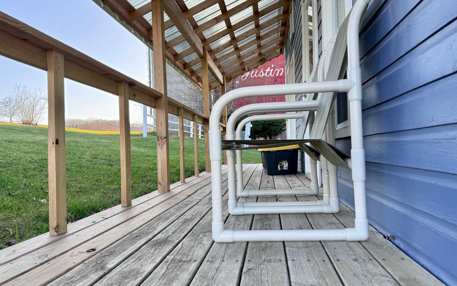 The porch of the Camping Cabin is at ground level and offers seating for taking in the wonderful country views.