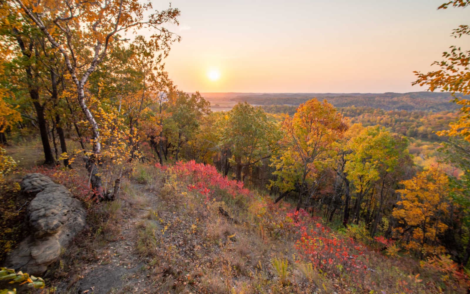 View to the East from The Rock at 7:00 am on a Fall day with the morning sun lighting the colors of the changing leaves.