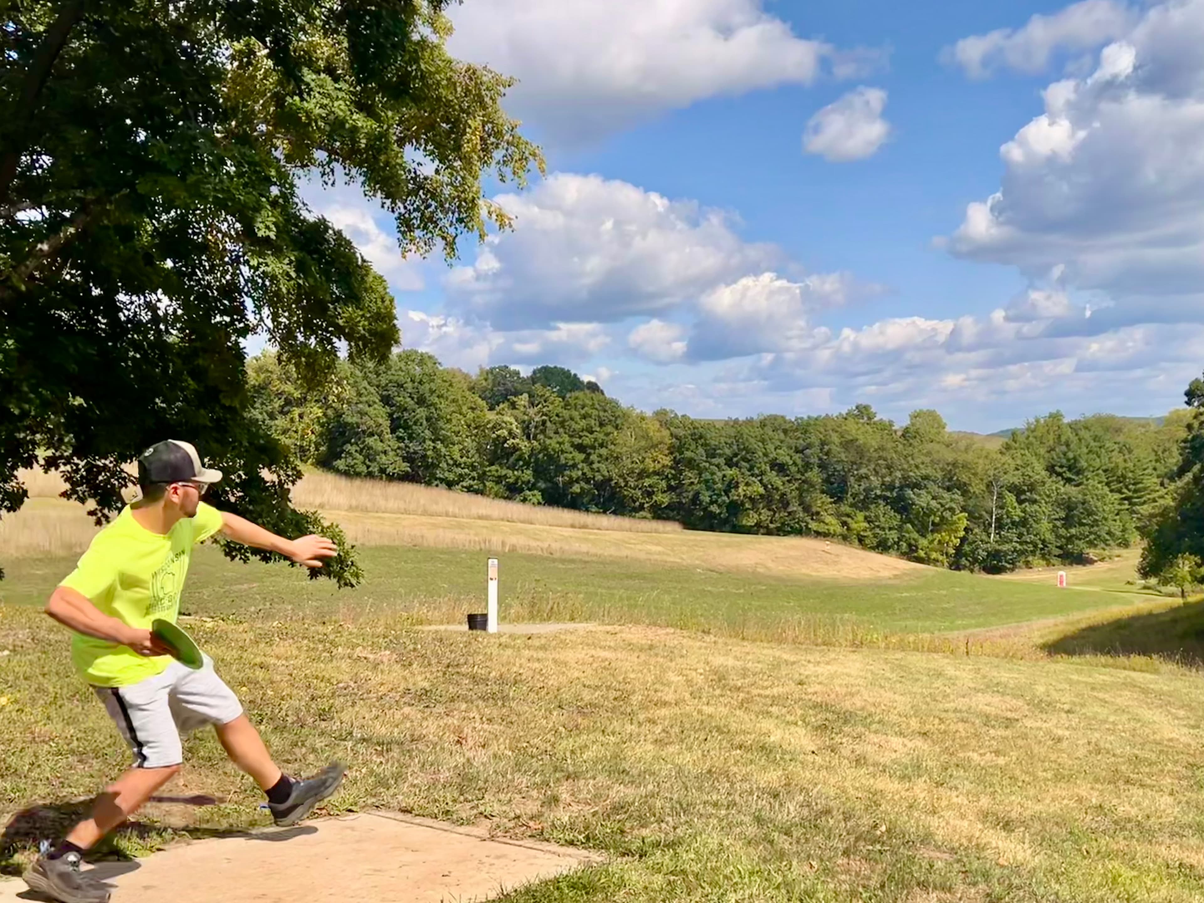 A man preparing to throw a disc golf disc