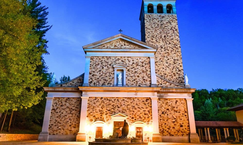 Shrine of Our Lady of Guadalupe illuminated at dusk near La Crosse, Wisconsin, a peaceful day trip stop from Sparta.